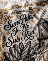Gros plan sur l'impression sublimation du sac à baguettes, détail moulin et typographie vintage noir et or