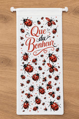Sac à baguettes Que du Bonheur coccinelles posé sur table de cuisine en bois